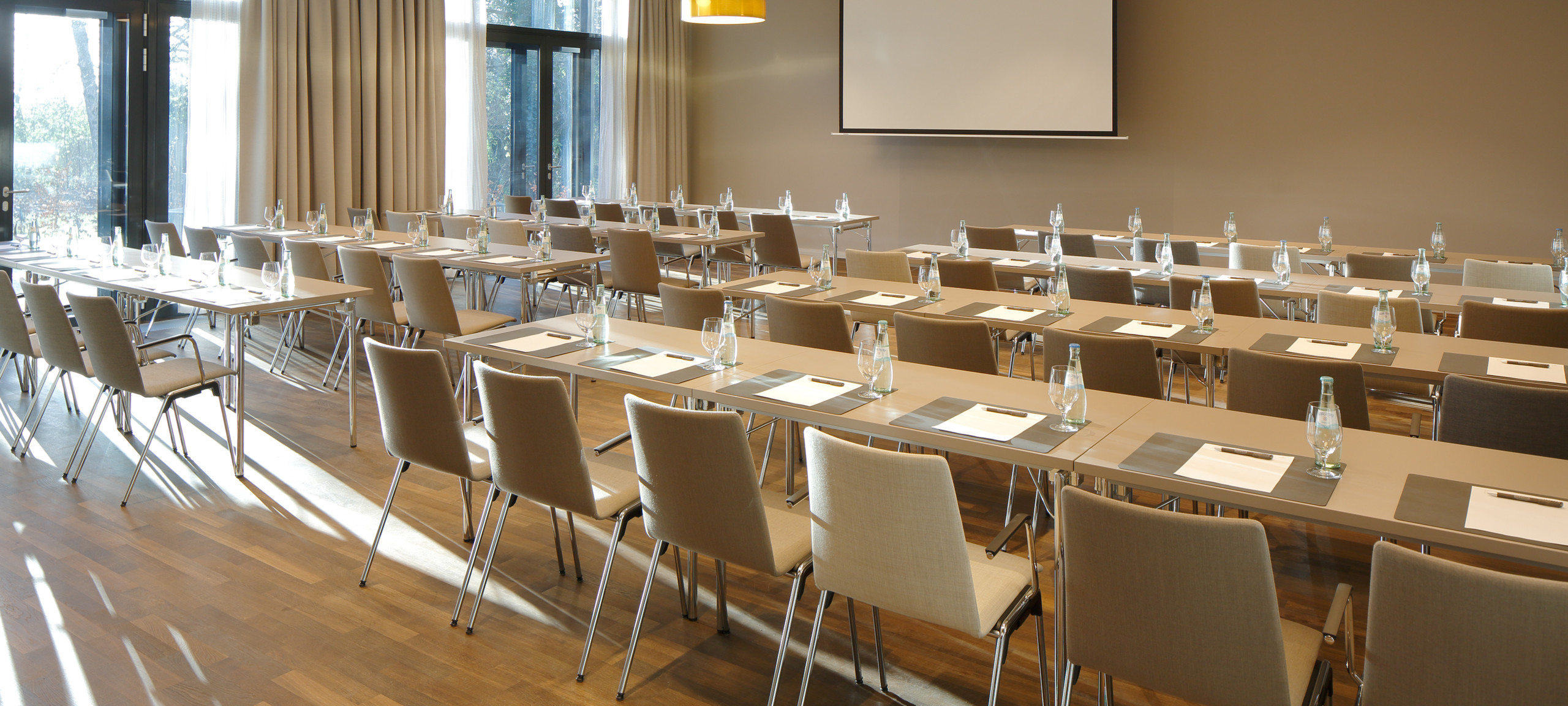 Conference room with beige tables and chairs